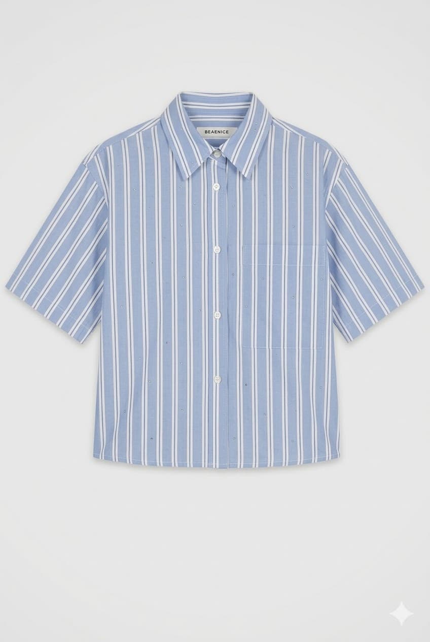 Un chemisier raffiné en soie fluide, coupé pour une silhouette gracieuse et élégante.